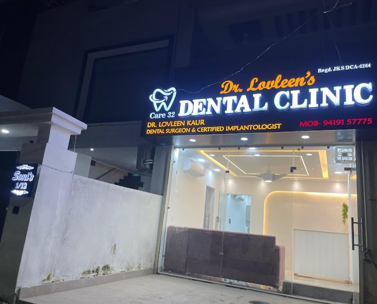 Illuminated sign and entrance of Dr. Lovleen's Dental Clinic